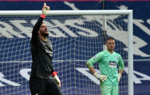 Liverpool goalkeeper Alisson Becker (left)dedicated his winning goal over West Brom to his late father