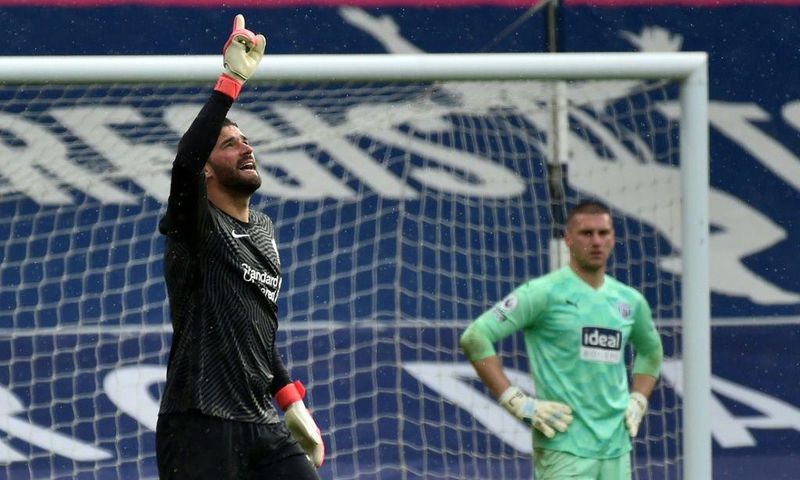 Liverpool goalkeeper Alisson Becker (left)dedicated his winning goal over West Brom to his late father