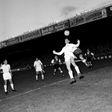 First to the ball: Raymond Kopa of Real Madrid holds off Michel Leblond of Reims in the first European Cup final in Paris in June 1956
