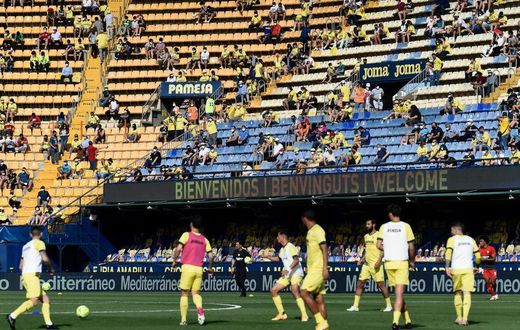Home again: Villarreal fans watch their team warm up