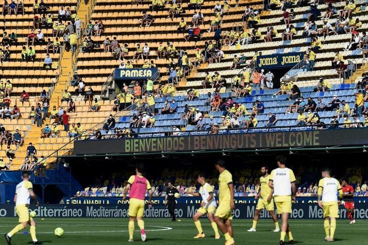 Home again: Villarreal fans watch their team warm up