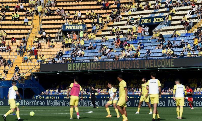 Home again: Villarreal fans watch their team warm up