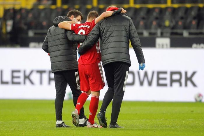 Bayern Munich midfielder Joshua Kimmich (C) has been out since suffering knee injury in the league game at Dortmund in early November