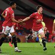 Dan the man: Daniel James (centre)celebrates scoring Manchester United's second goal