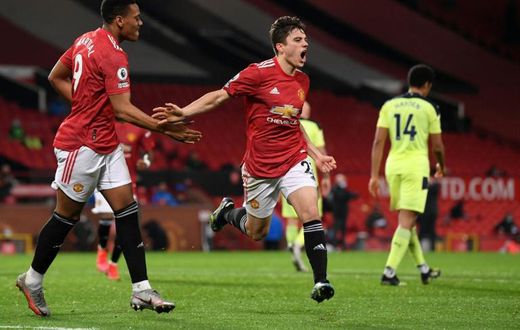 Dan the man: Daniel James (centre)celebrates scoring Manchester United's second goal