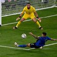 Swiss midfielder Steven Zuber (L) had a shot saved by Gianluigi Donnarumma (C)
