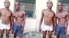 Suspected robbers pose for the cameras after being arrested by security operatives