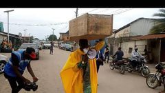 Archbishop Samson Benjamin embarks on a one-man protest with a coffin on his head