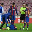 Down but not out: Lionel Messi lays on the ground after a foul