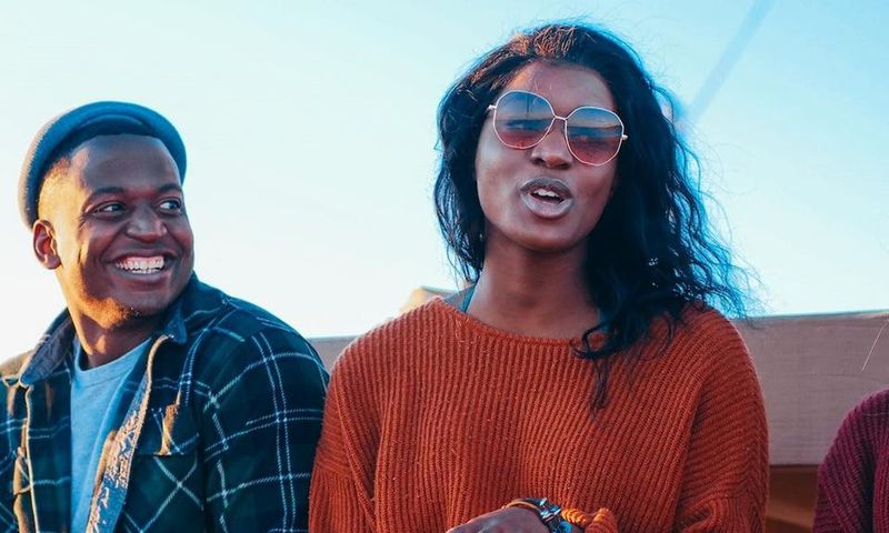 Smiling man looking at a woman who is speaking [Image: Kindel Media]