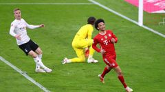 Leroy Sane (R) celebrates scoring Bayern Munich's final goal in a 6-0 thrashing of Moenchengladbach
