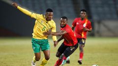 South African Sibusiso Mabiliso (L) and Ugandan Abdu Lumala seek possession during a friendly international in Soweto on Thursday.