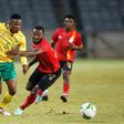 South African Sibusiso Mabiliso (L) and Ugandan Abdu Lumala seek possession during a friendly international in Soweto on Thursday.