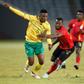 South African Sibusiso Mabiliso (L) and Ugandan Abdu Lumala seek possession during a friendly international in Soweto on Thursday.