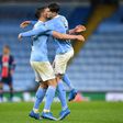 Manchester City's John Stones and Ruben Dias celebrate
