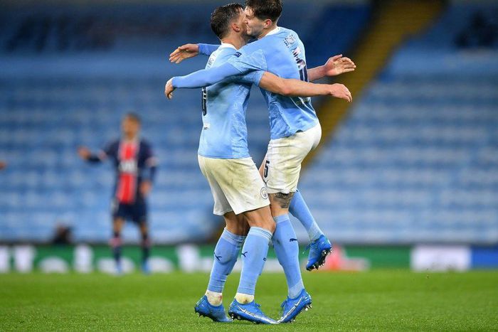 Manchester City's John Stones and Ruben Dias celebrate