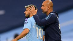 Pep Guardiola (right) is counting on Sergio Aguero's (left)return to help ease Manchester City's goal drought