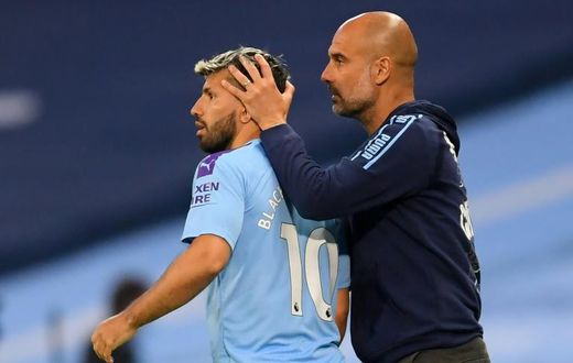 Pep Guardiola (right) is counting on Sergio Aguero's (left)return to help ease Manchester City's goal drought