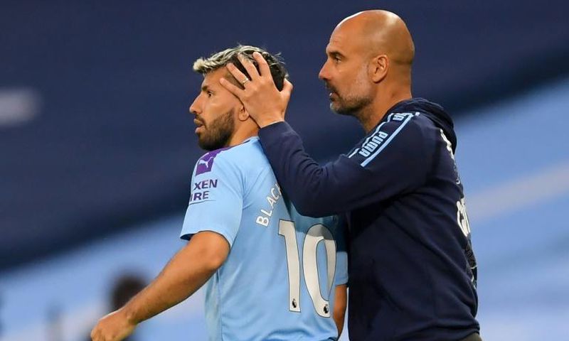 Pep Guardiola (right) is counting on Sergio Aguero's (left)return to help ease Manchester City's goal drought