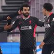 Liverpool forward Mohamed Salah (C) celebrates scoring  against West Ham