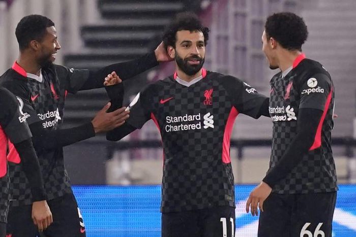Liverpool forward Mohamed Salah (C) celebrates scoring  against West Ham