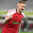 Handed a win: Freiburg's Jonathan Schmid celebrated after scoring as Freiburg beat Borussia Dortmund