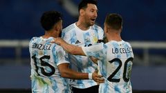 Argentina's Lionel Messi (center) celebrates his goal against Chile at the 2021 Copa America with teammates Nicolas Gonzalez (left) and Giovani Lo Celso