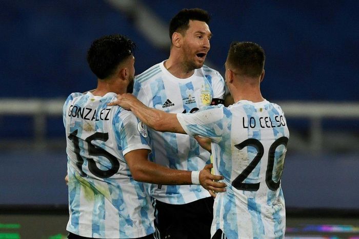 Argentina's Lionel Messi (center) celebrates his goal against Chile at the 2021 Copa America with teammates Nicolas Gonzalez (left) and Giovani Lo Celso