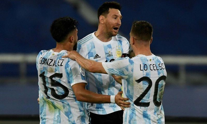 Argentina's Lionel Messi (center) celebrates his goal against Chile at the 2021 Copa America with teammates Nicolas Gonzalez (left) and Giovani Lo Celso