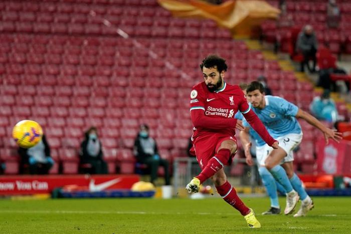 Mohamed Salah levels for Liverpool from a penalty in a 4-1 loss to Manchester City at Anfield.
