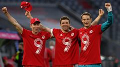 (L-R) Bayern Munich stars Robert Lewandowski, Thomas Mueller and Manuel Neuer celebrate their ninth league title in a row