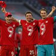 (L-R) Bayern Munich stars Robert Lewandowski, Thomas Mueller and Manuel Neuer celebrate their ninth league title in a row