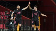 Real Madrid's Karim Benzema (left) celebrates scoring a goal with 19-year-old defender Miguel Gutierrez against Granada on Thursday.