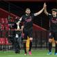 Real Madrid's Karim Benzema (left) celebrates scoring a goal with 19-year-old defender Miguel Gutierrez against Granada on Thursday.