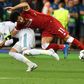Mo Salah (right) is pulled to the ground by Sergio Ramos leading to a dislocated shoulder during the 2018 Champions League final in Kiev