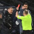 Referee Jon Moss (R) shows a red card to Aston Villa manager Dean Smith (L) during a 2-0 loss away to Manchester City on January 20