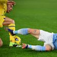 Lazio's Manuel Lazzari (R) scored an own goal against Hellas Verona.
