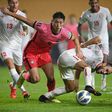 South Korea's Cho Gue-sung (left) competes for the ball with Lebanon's Abbas Asi