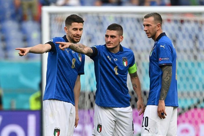 (L to R): Italy's Jorginho, Marco Verratti and Federico Bernardeschi plot victory against Wales