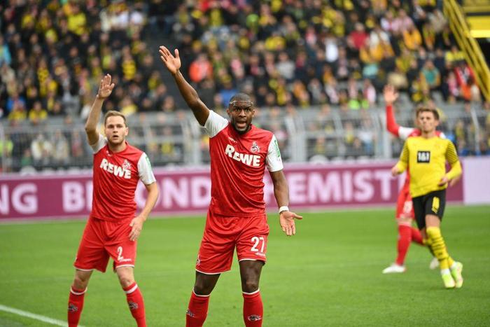 Cologne's French forward Anthony Modeste (C) scored twice against Wolfsburg on Tuesday