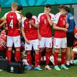 Denmark players formed a circle around Christian Eriksen (not seen) as paramedics saved his life during Euro 2020