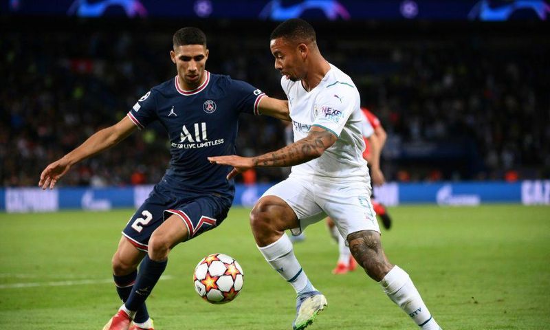 Paris Saint-Germain full-back Achraf Hakimi (L) scored the first goal as Morocco trounced Guinea-Bissau 5-0 on Wednesday in a World Cup qualifier