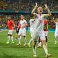 Switzerland's Granit Xhaka leads the celebrations after their victory over the world champions