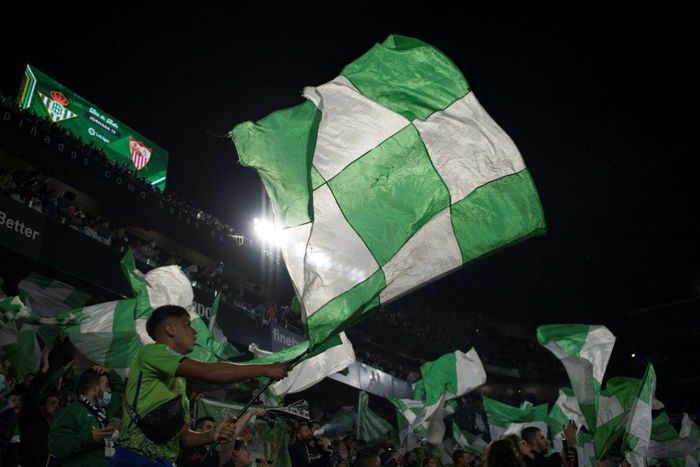 Real Betis' supporters wave flags before the start of the Seville derby against Sevilla on Sunday.