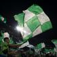 Real Betis' supporters wave flags before the start of the Seville derby against Sevilla on Sunday.