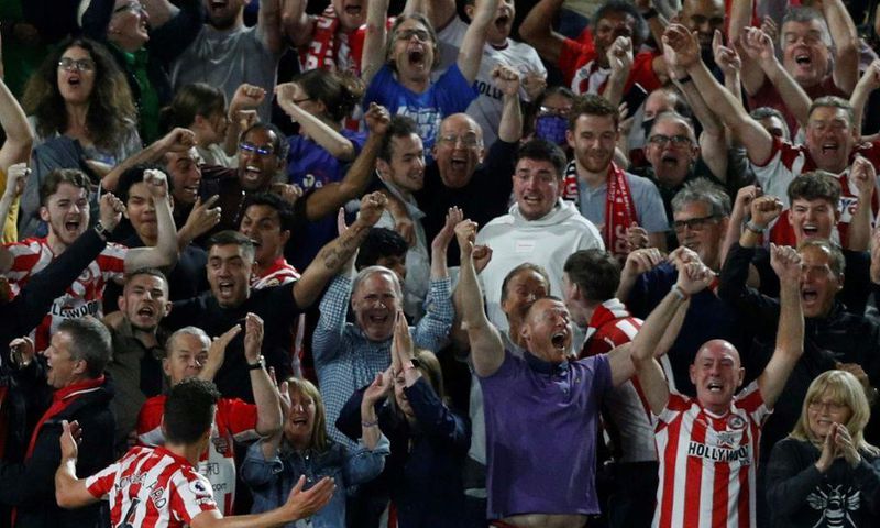 Bouncing Bees: Christian Norgaard (left) celebrates Brentford's second goal in a 2-0 win over Arsenal to open the Premier League season