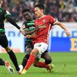 Freiburg's South Korean midfielder Jeong Woo-yeong (R) is relishing facing Bayern Munich on Saturday