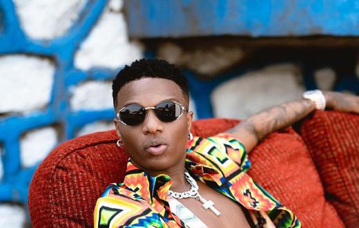 Wizkid loves his floral beach shirts {instagram/wizkid}