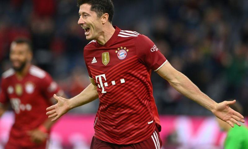 Bayern Munich striker Robert Lewandowski celebrates his hat-trick in the 5-0 thrashing of Hertha Berlin
