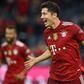 Bayern Munich striker Robert Lewandowski celebrates his hat-trick in the 5-0 thrashing of Hertha Berlin